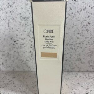 Oribe Flash Form Spray Wax in Black and Cream